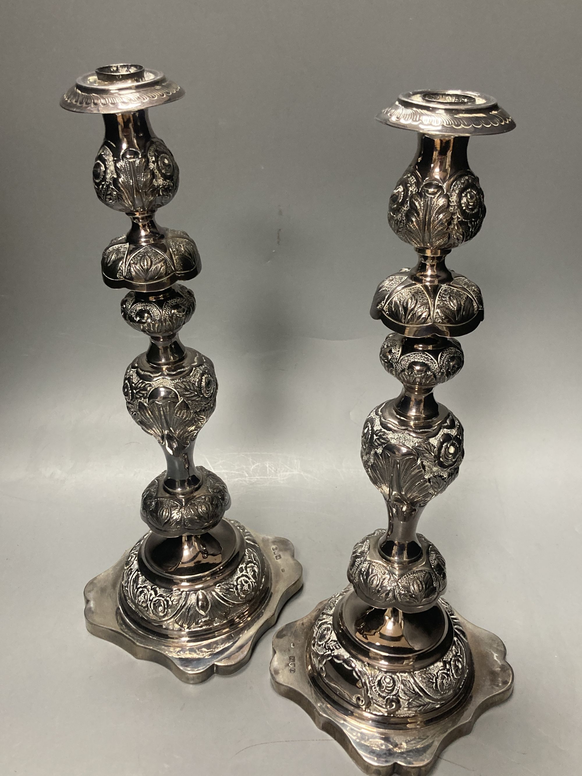 A pair of Edwardian silver Sabbath Day candlesticks, by Rosenzweig & Taitelbaum, London, 1909, 37.5cm, 34oz.